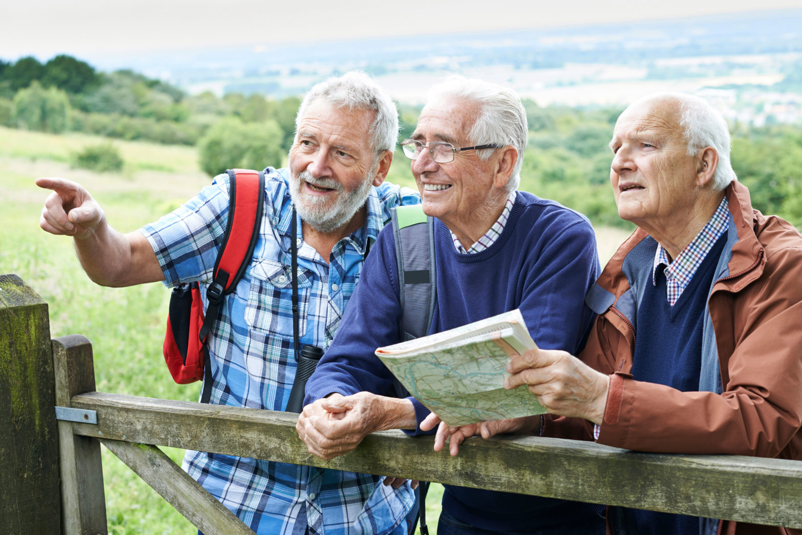 three elderly men outside