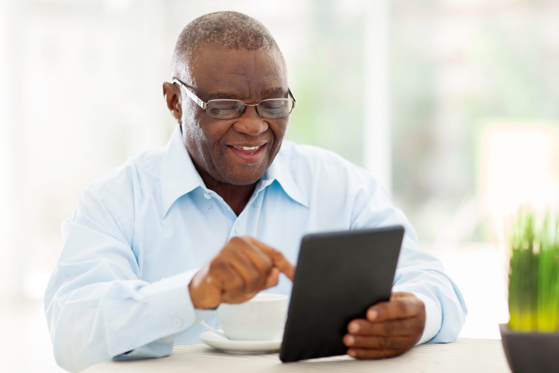 man on tablet device