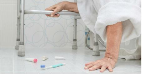 woman picking up toiletries