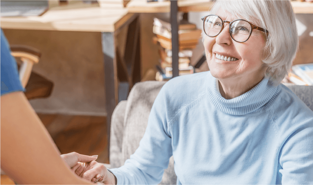 Woman smiling up at nurse