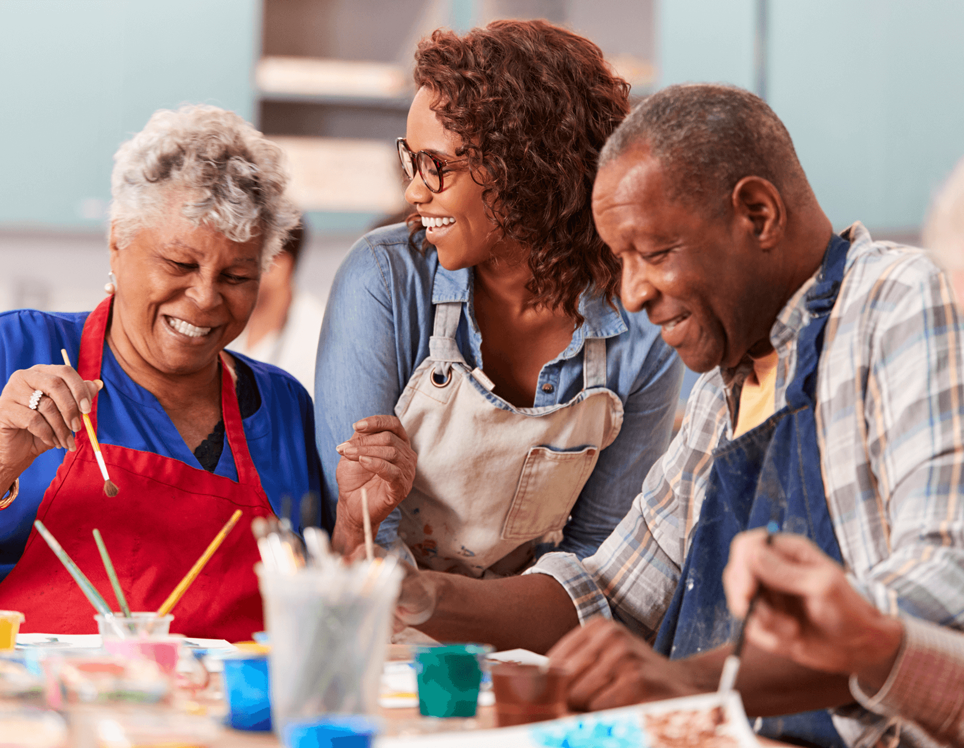 woman painting with seniors