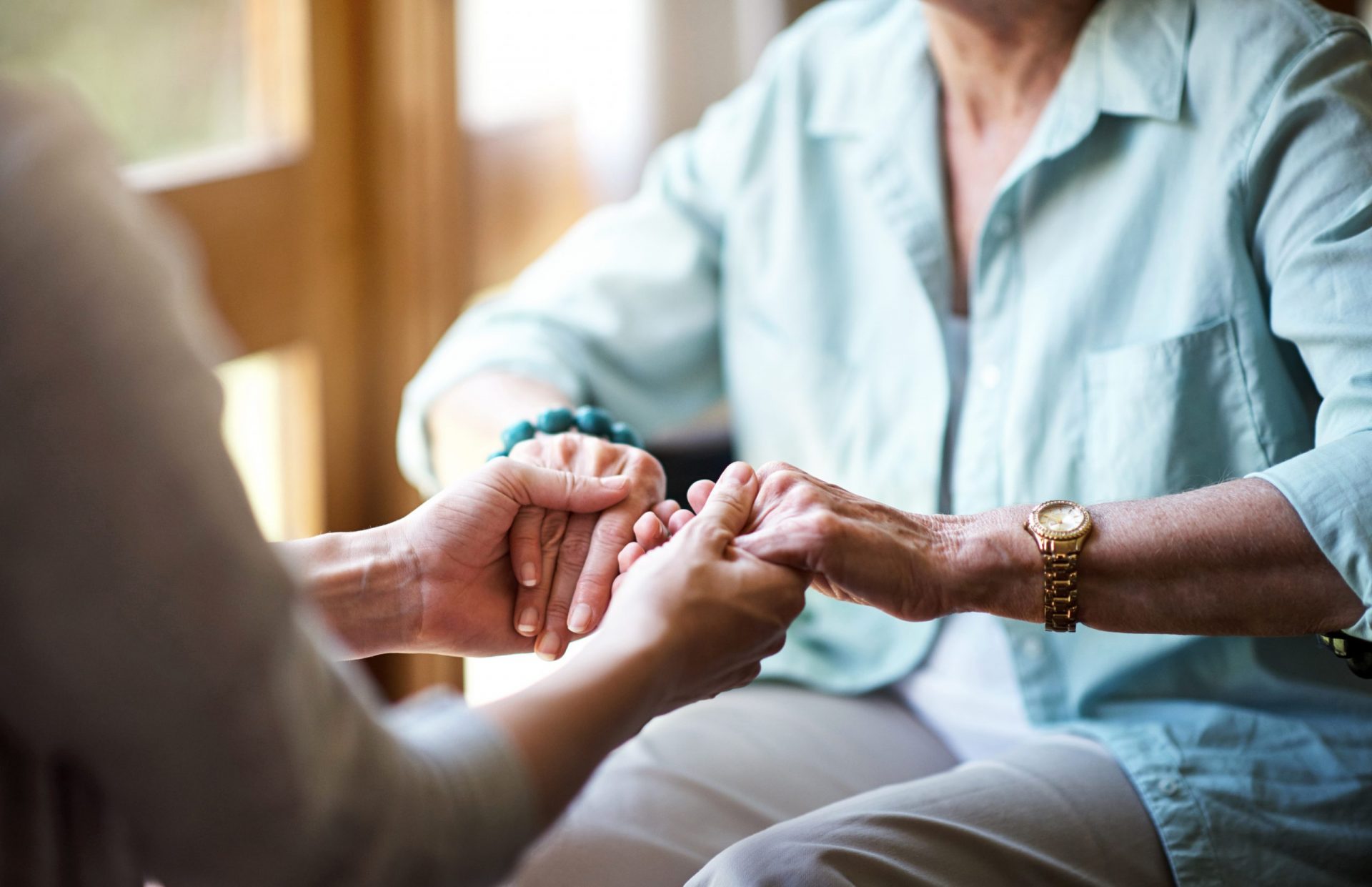 Two people holding hands